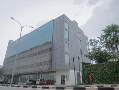 A modern building with blue and gray facade.