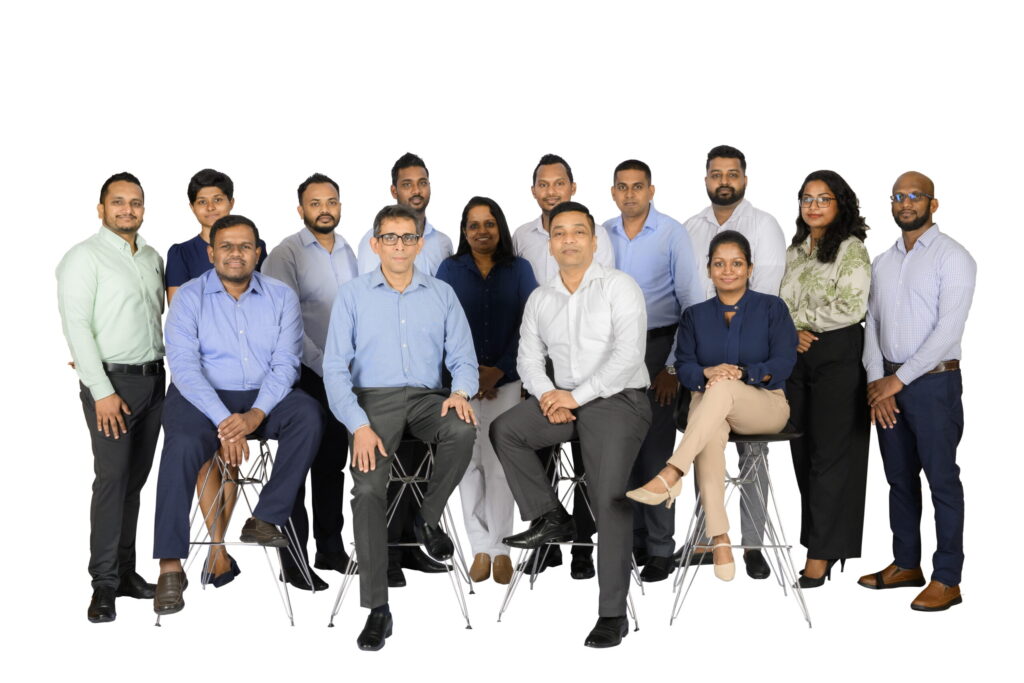 A diverse group of professionals posing together.