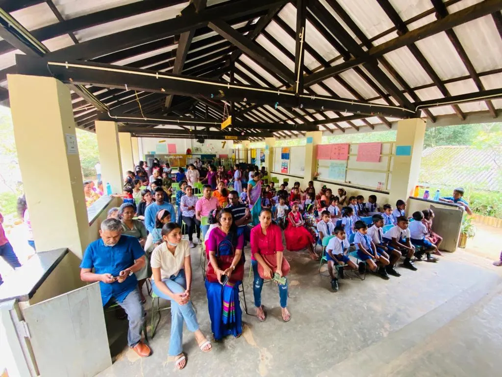 A large group of students and adults gathered.