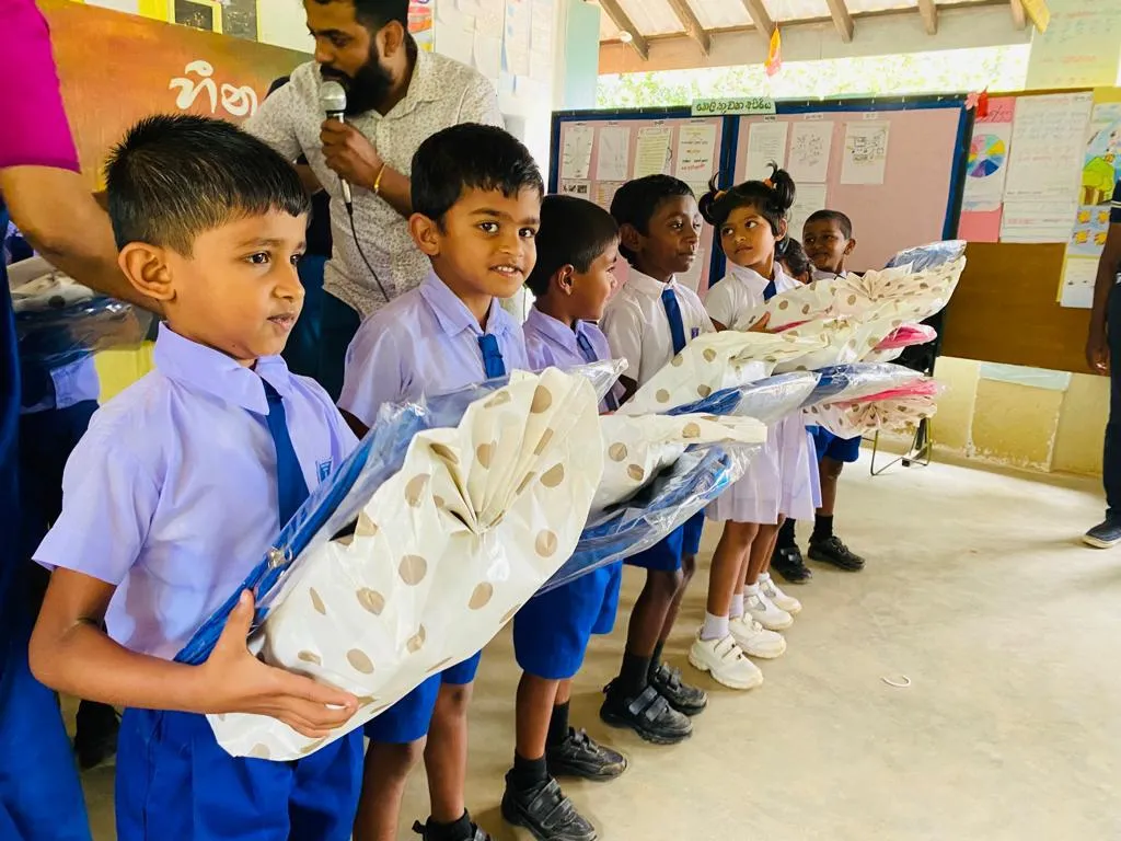 Young students holding wrapped gifts at school.